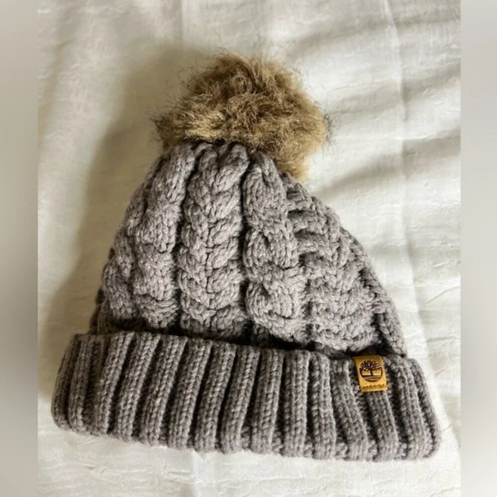 Timberland Women`s Cable Knit Cuff Pom Beanie  Fleece lined Color Gray